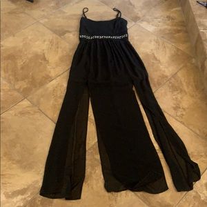 Black dress with textured belt and sheer maxi